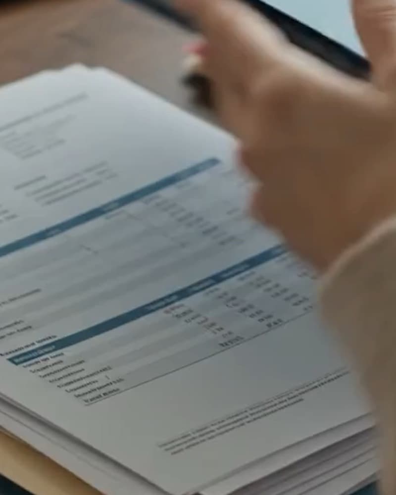 A reviewer going through printed documents